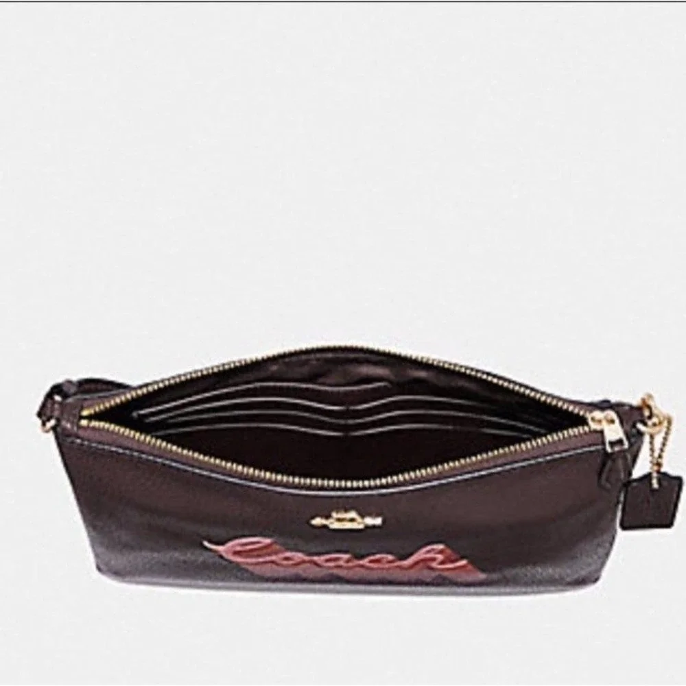 LARGE WRISTLET 25 WITH NEON COACH SCRIPT COACH NWT